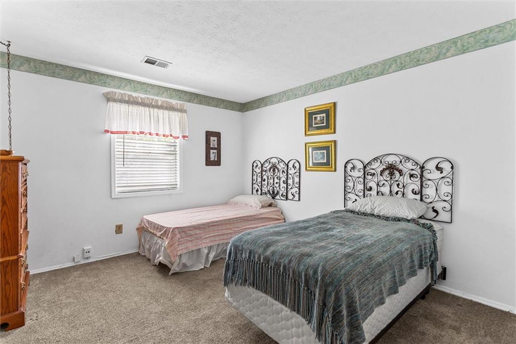 1610 Raleigh Circle Marietta, GA 30067 - Photo 20 of 33 a bedroom with a bed and a window