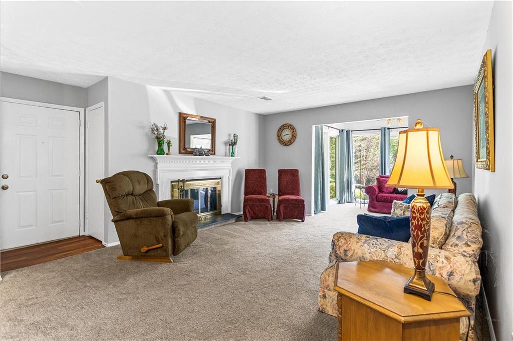 1610 Raleigh Circle Marietta, GA 30067 - Photo 2 of 33 a living room with furniture and a fireplace