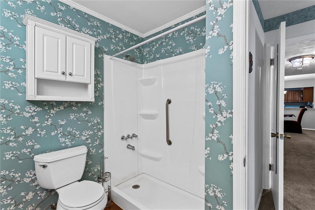 1610 Raleigh Circle Marietta, GA 30067 - Photo 24 of 33 a white toilet sitting next to a bathroom sink