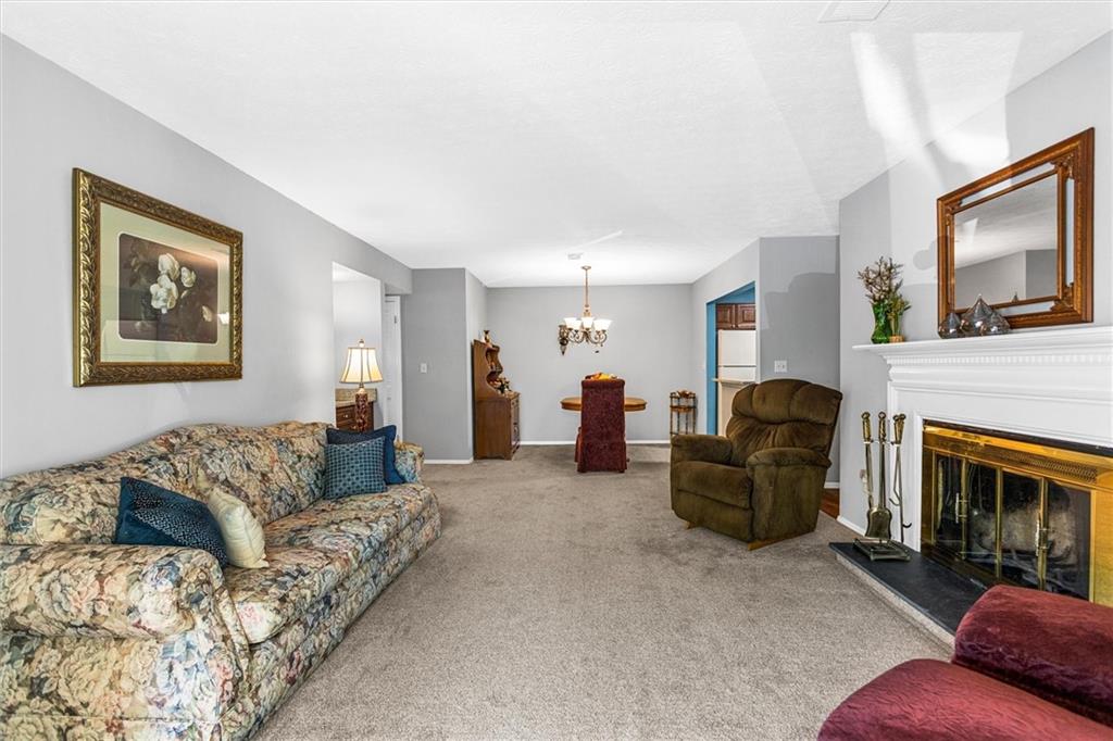 1610 Raleigh Circle Marietta, GA 30067 - Photo 5 of 33 a living room with furniture and a fireplace