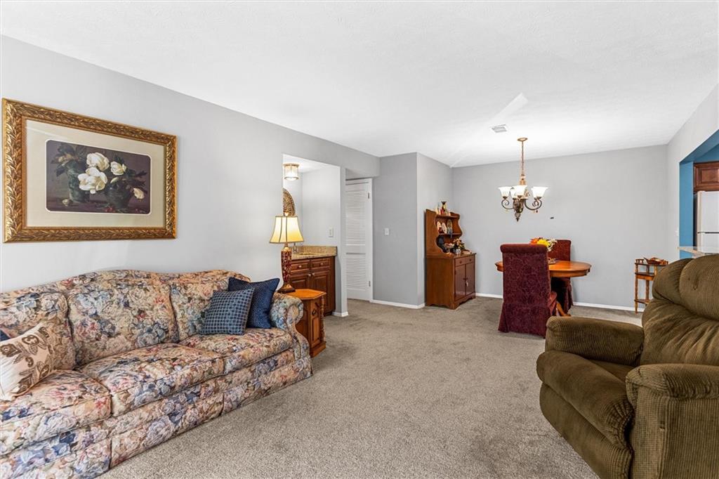1610 Raleigh Circle Marietta, GA 30067 - Photo 6 of 33 a living room with furniture and a couch
