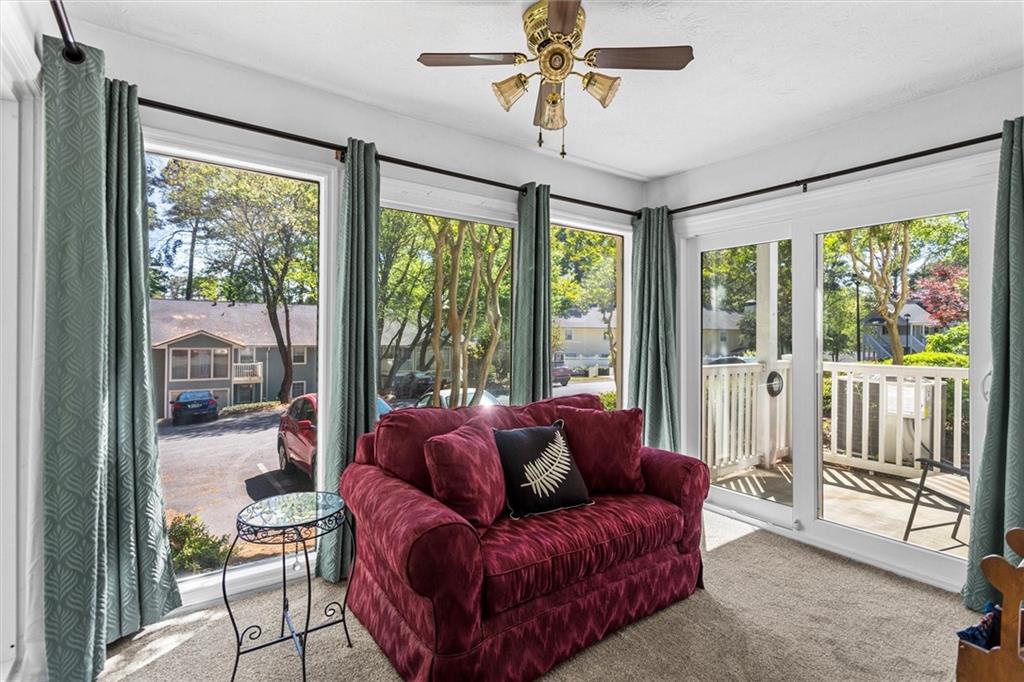 1610 Raleigh Circle Marietta, GA 30067 - Photo 8 of 33 a living room with furniture and a floor to ceiling window