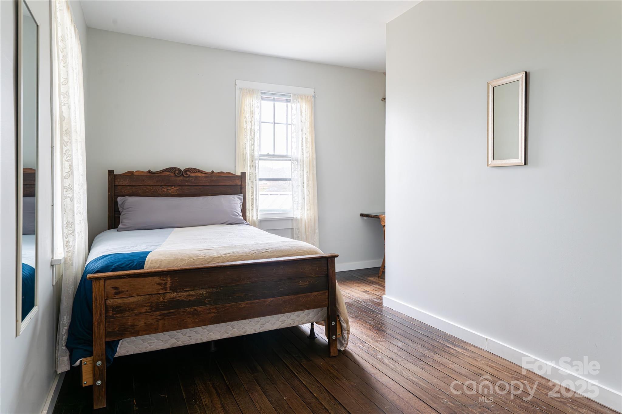 40 Jonestown Road Asheville, NC 28804 - Photo 15 of 46 a bedroom with a bed and window