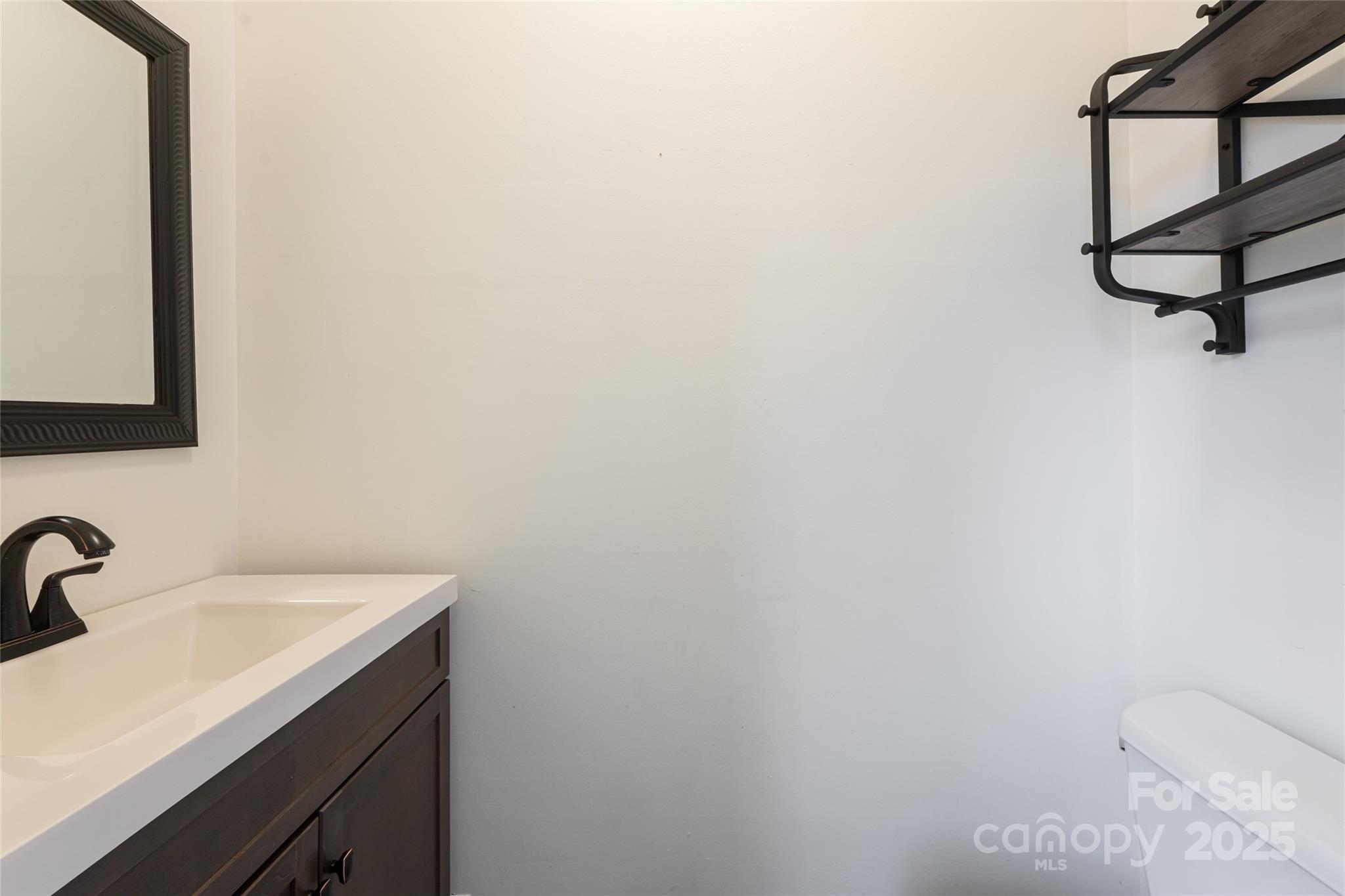 40 Jonestown Road Asheville, NC 28804 - Photo 18 of 46 a bathroom with a sink and mirror