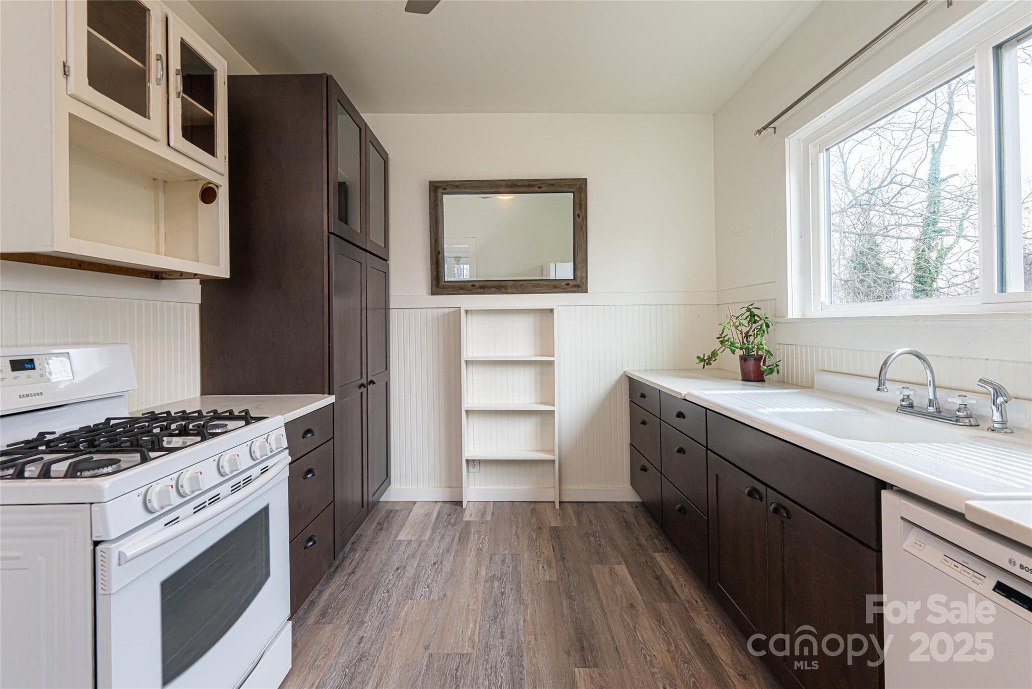 40 Jonestown Road Asheville, NC 28804 - Photo 19 of 46 a kitchen with a stove a sink and a window
