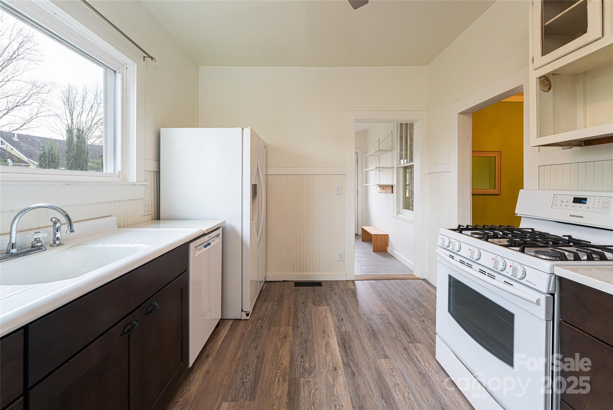 40 Jonestown Road Asheville, NC 28804 - Photo 22 of 46 a kitchen with a stove a sink and a refrigerator