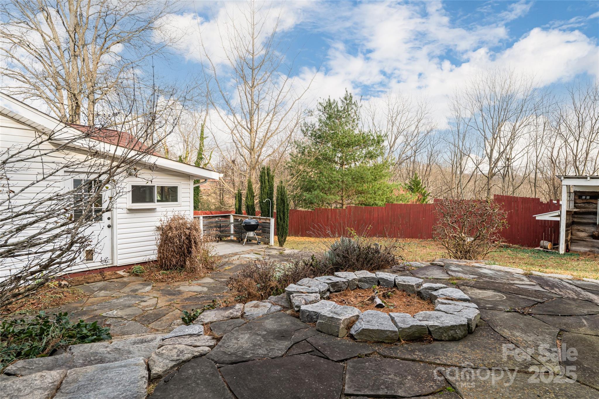 40 Jonestown Road Asheville, NC 28804 - Photo 35 of 46 a backyard of a house with table and chairs