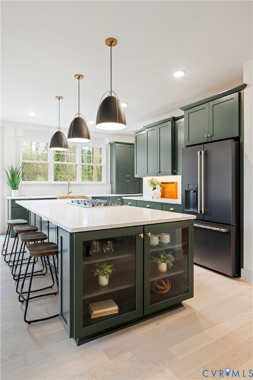 8919 Rustic Road Richmond, VA 23235 - Photo 11 of 36 Kitchen featuring dark green cabinetry, a central