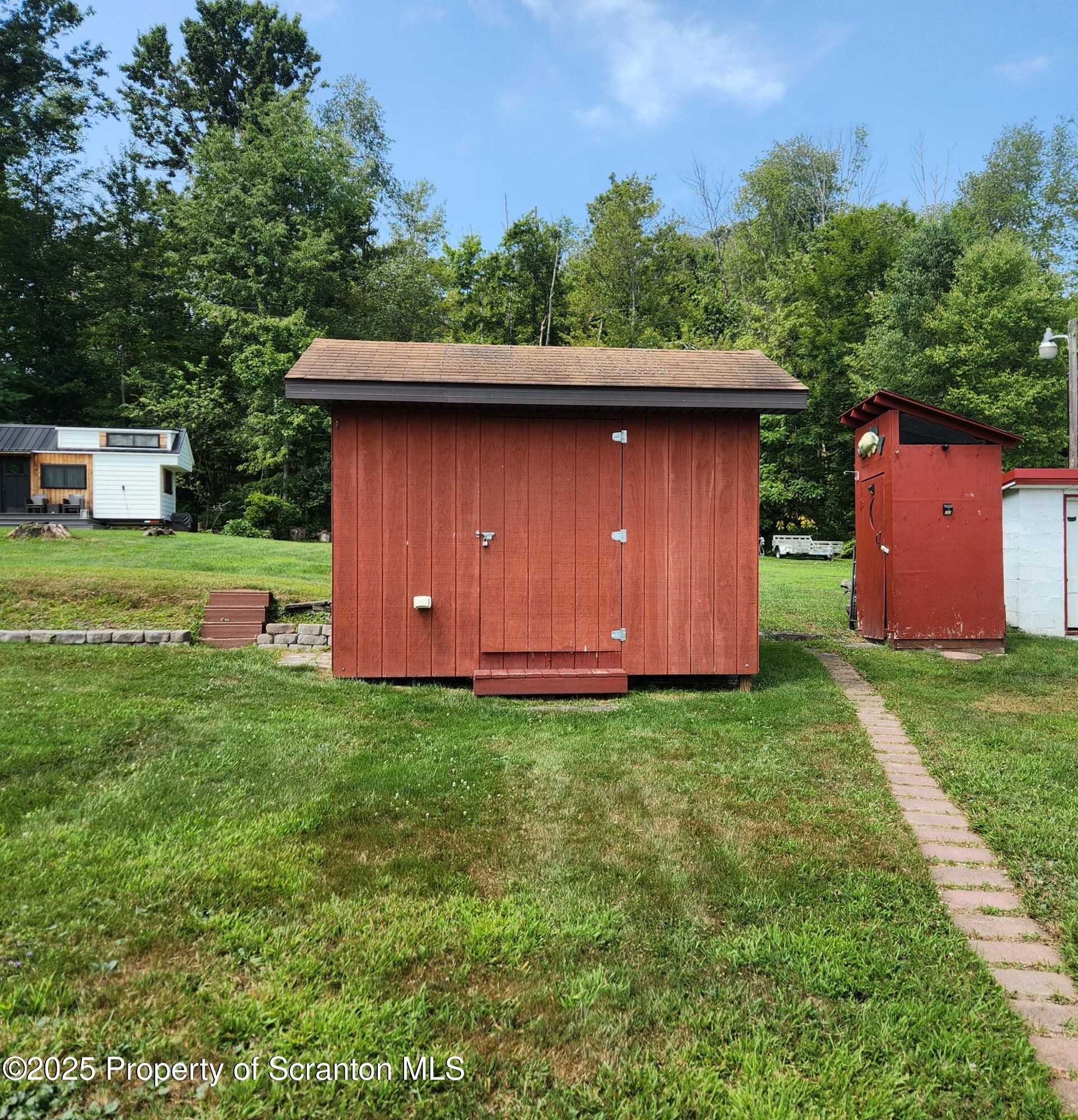 135 Pedrick Road Nicholson, PA 18446 - Photo 12 of 16 a backyard of a house with lots of green space