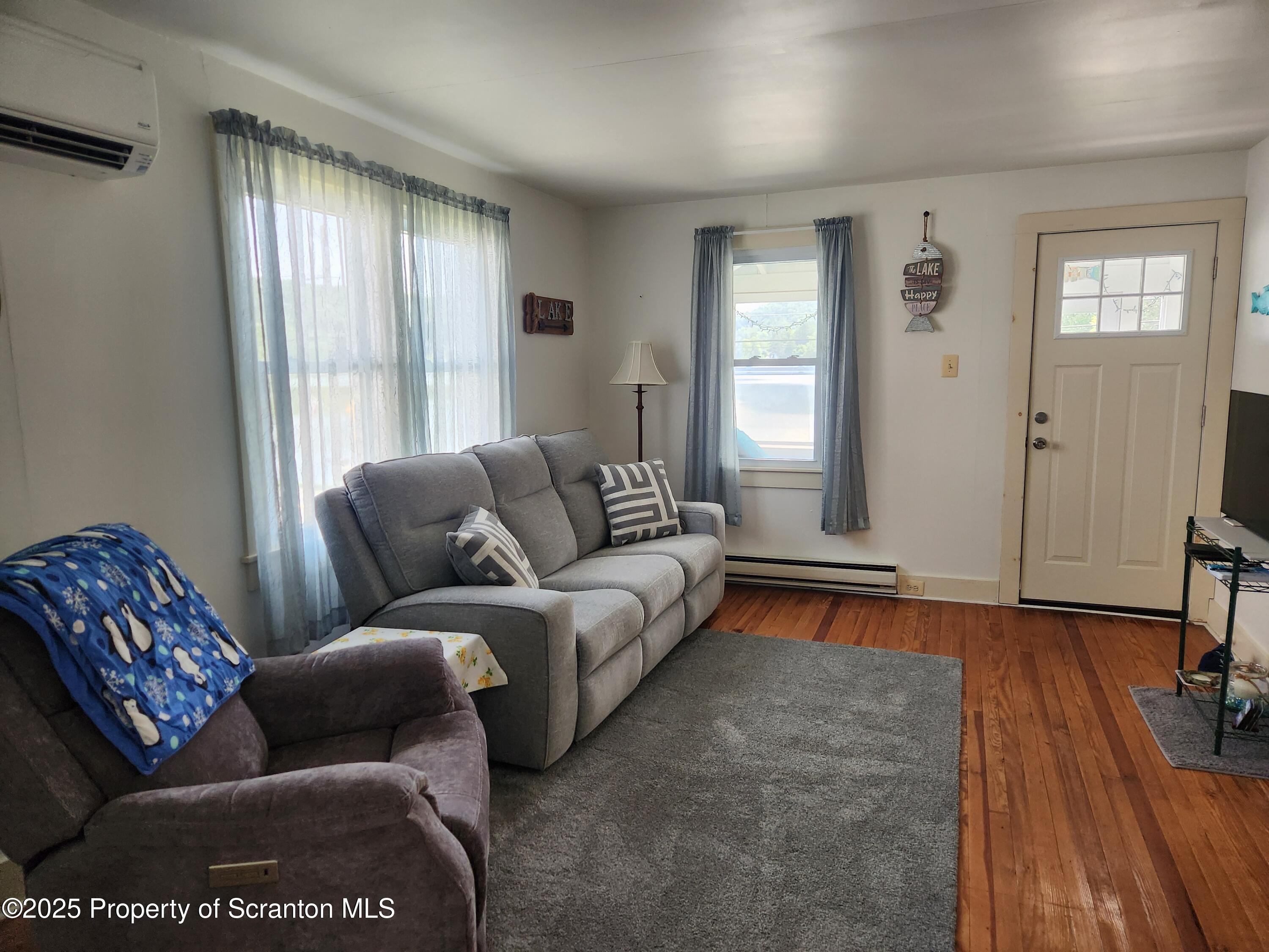 135 Pedrick Road Nicholson, PA 18446 - Photo 5 of 16 a living room with furniture and a window