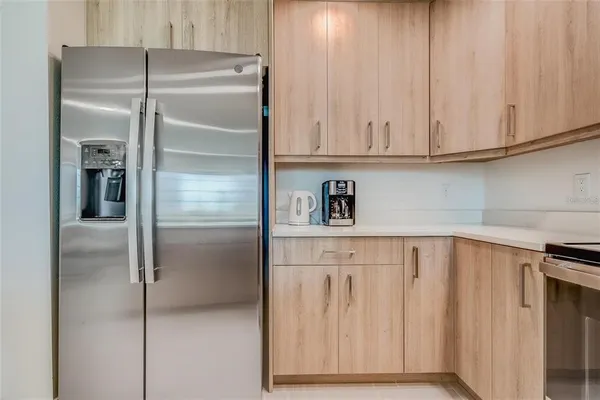 a kitchen with stainless steel appliances granite countertop a stove a microwave and cabinets