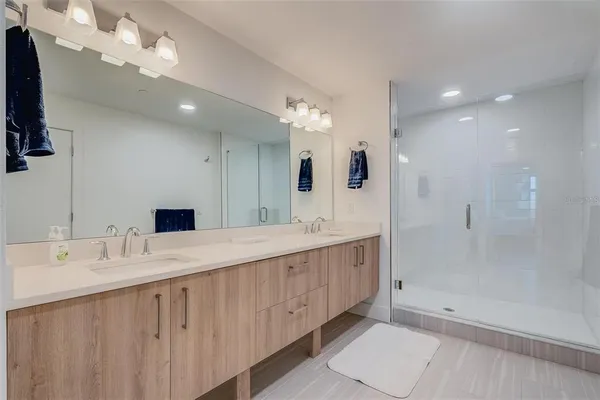 a white toilet sitting next to a white sink