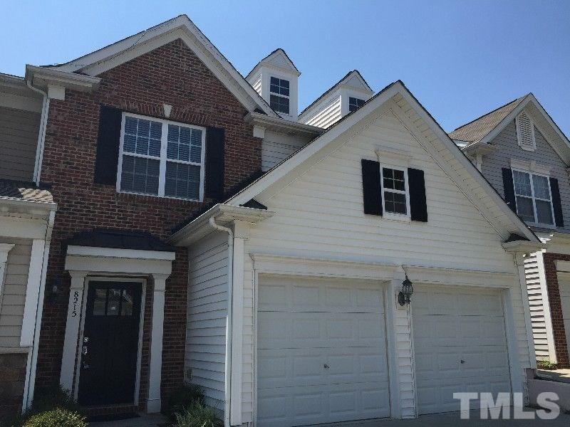 8215 Pilots View Drive Raleigh, NC 27617 - Photo 1 of 18 a front view of a house with a yard