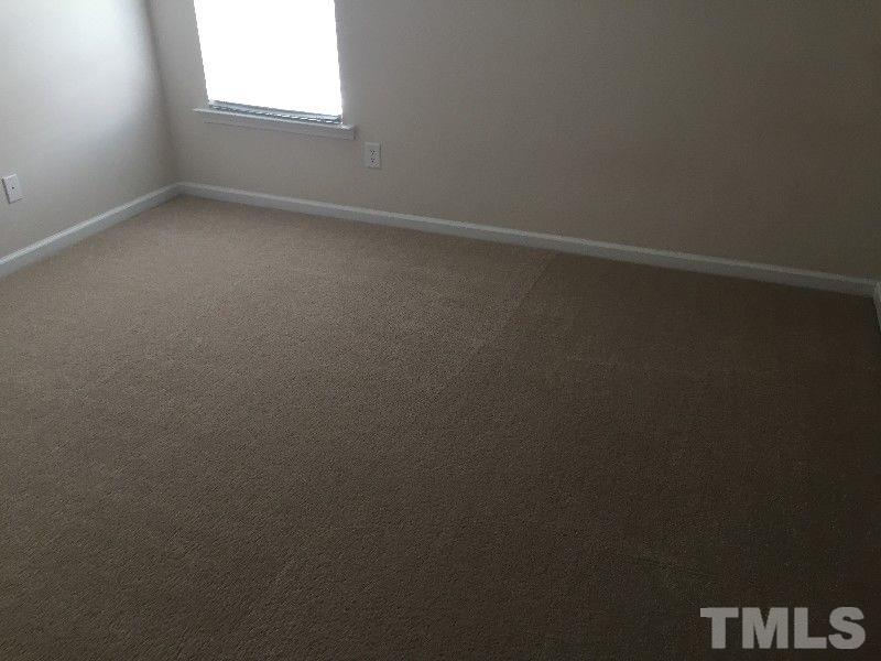8215 Pilots View Drive Raleigh, NC 27617 - Photo 12 of 18 an empty room that has a window