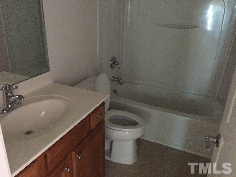 8215 Pilots View Drive Raleigh, NC 27617 - Photo 13 of 18 a bathroom with a sink toilet and shower