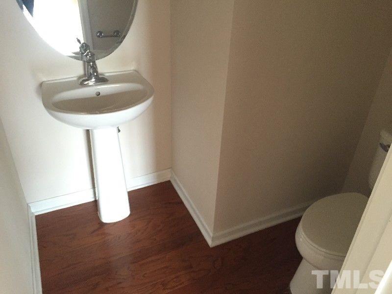 8215 Pilots View Drive Raleigh, NC 27617 - Photo 17 of 18 a bathroom with a sink and a mirror