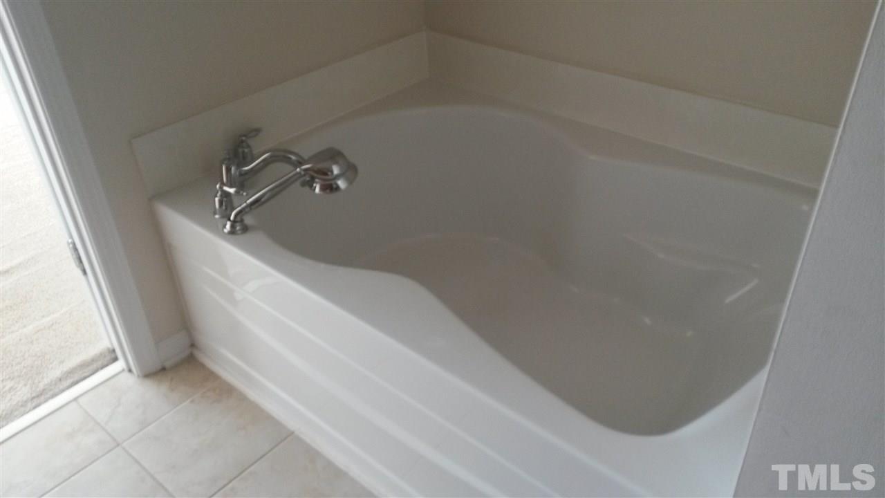 8215 Pilots View Drive Raleigh, NC 27617 - Photo 10 of 18 a bathroom with a bathtub