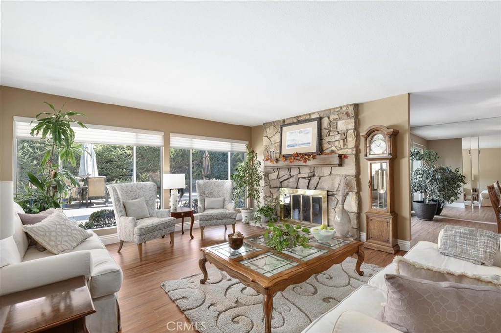 12110 Braemore Place Porter Ranch, CA 91326 - Photo 12 of 45 a living room with furniture and a large window