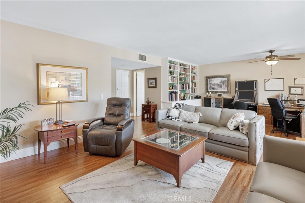 12110 Braemore Place Porter Ranch, CA 91326 - Photo 19 of 45 a living room with furniture or couch and a wooden floor