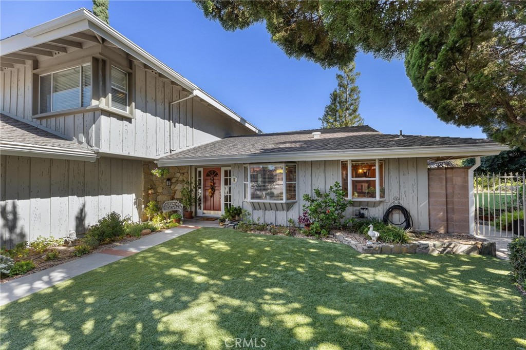 12110 Braemore Place Porter Ranch, CA 91326 - Photo 2 of 45 a view of a house with a yard and sitting area