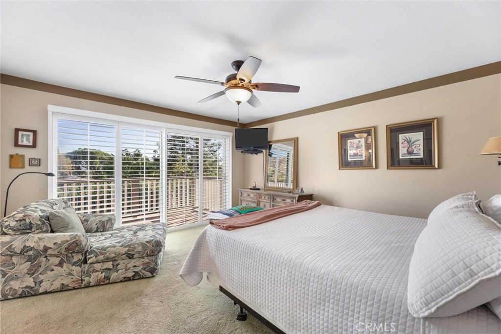 12110 Braemore Place Porter Ranch, CA 91326 - Photo 21 of 45 a bedroom with a large bed and a large window