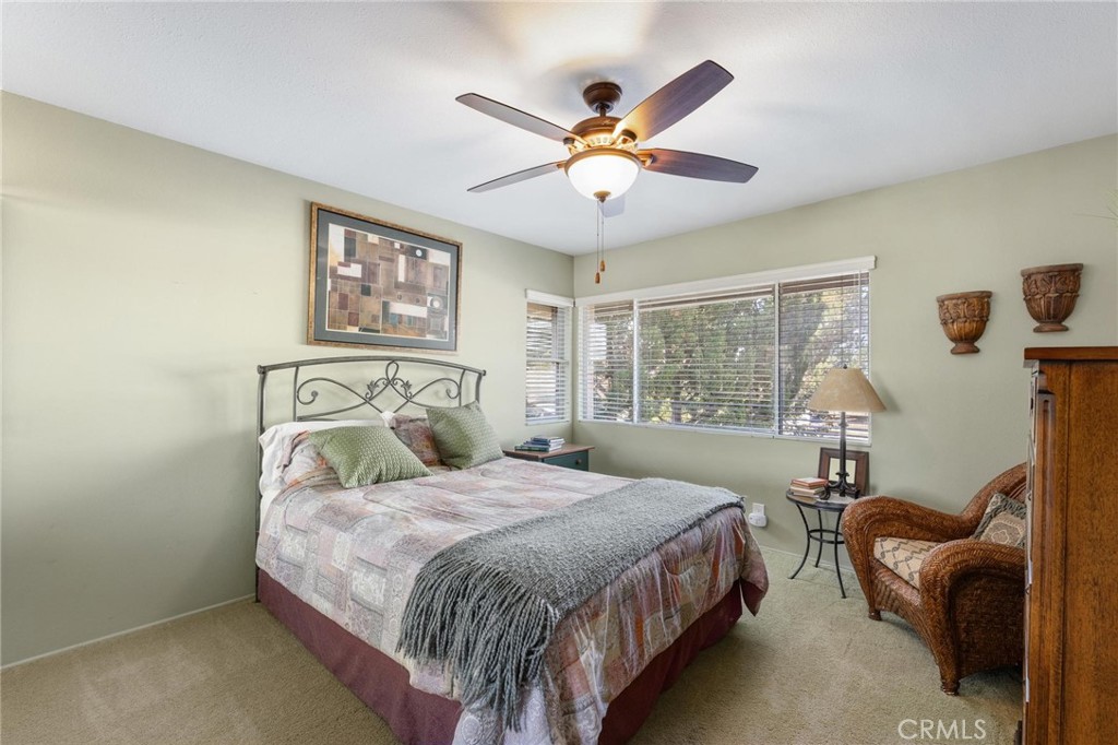 12110 Braemore Place Porter Ranch, CA 91326 - Photo 27 of 45 a bedroom with a bed and window