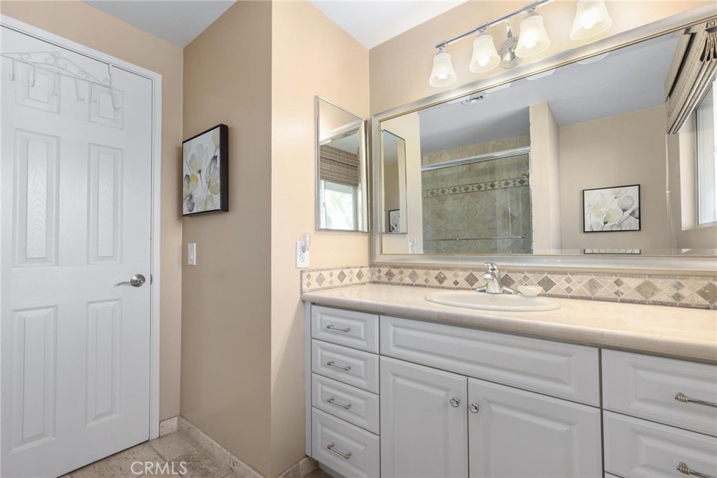 12110 Braemore Place Porter Ranch, CA 91326 - Photo 31 of 45 a bathroom with a sink and a mirror