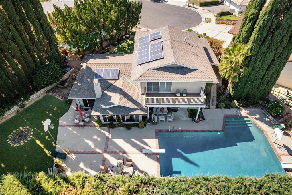 12110 Braemore Place Porter Ranch, CA 91326 - Photo 36 of 45 an aerial view of a house with swimming pool and garden