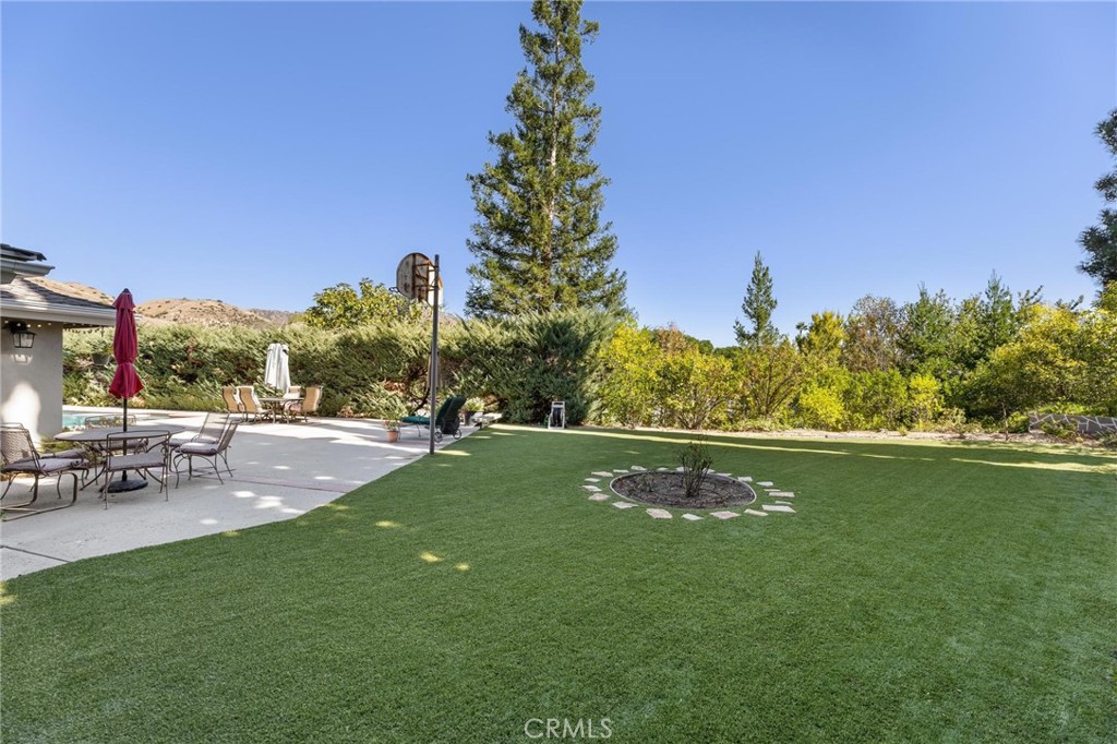 12110 Braemore Place Porter Ranch, CA 91326 - Photo 40 of 45 a view of a lake with a yard