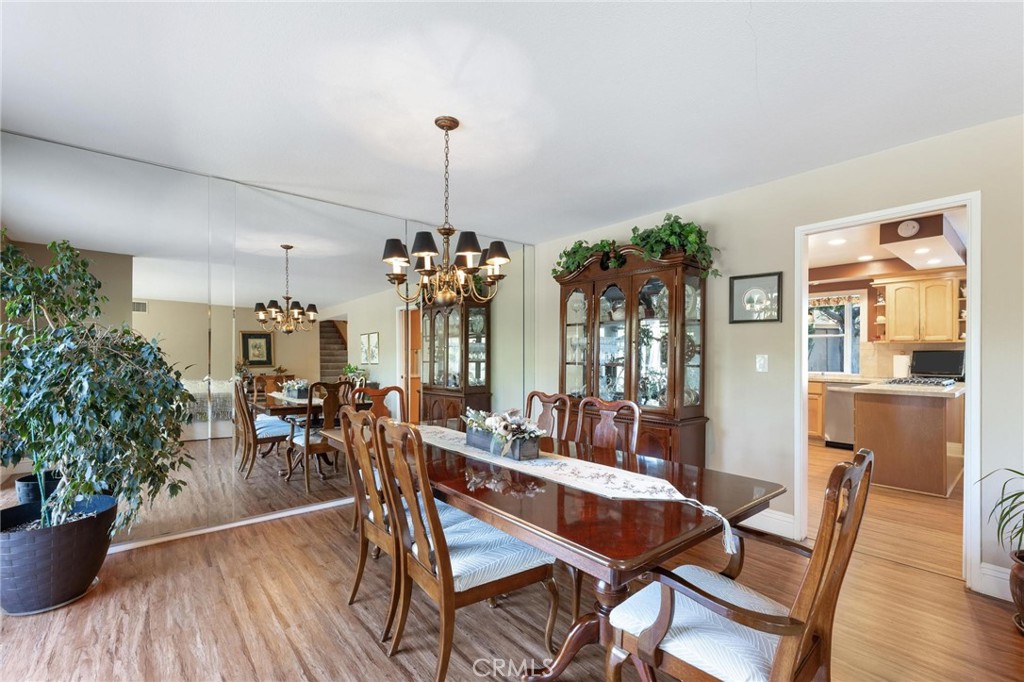 12110 Braemore Place Porter Ranch, CA 91326 - Photo 8 of 45 a view of a dining room with furniture window and wooden floor