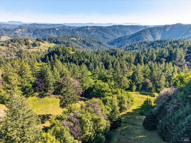a view of a backyard of the house