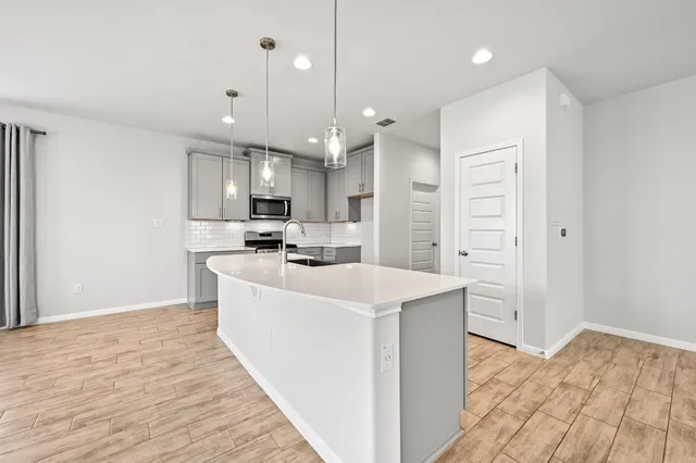 a large kitchen with cabinets