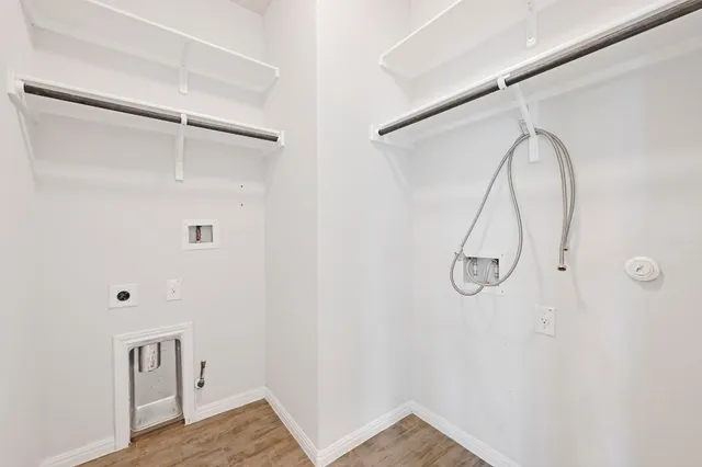 a view of a room with rack on the wall and a window