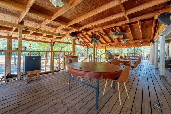 a view of a chairs and table on the deck