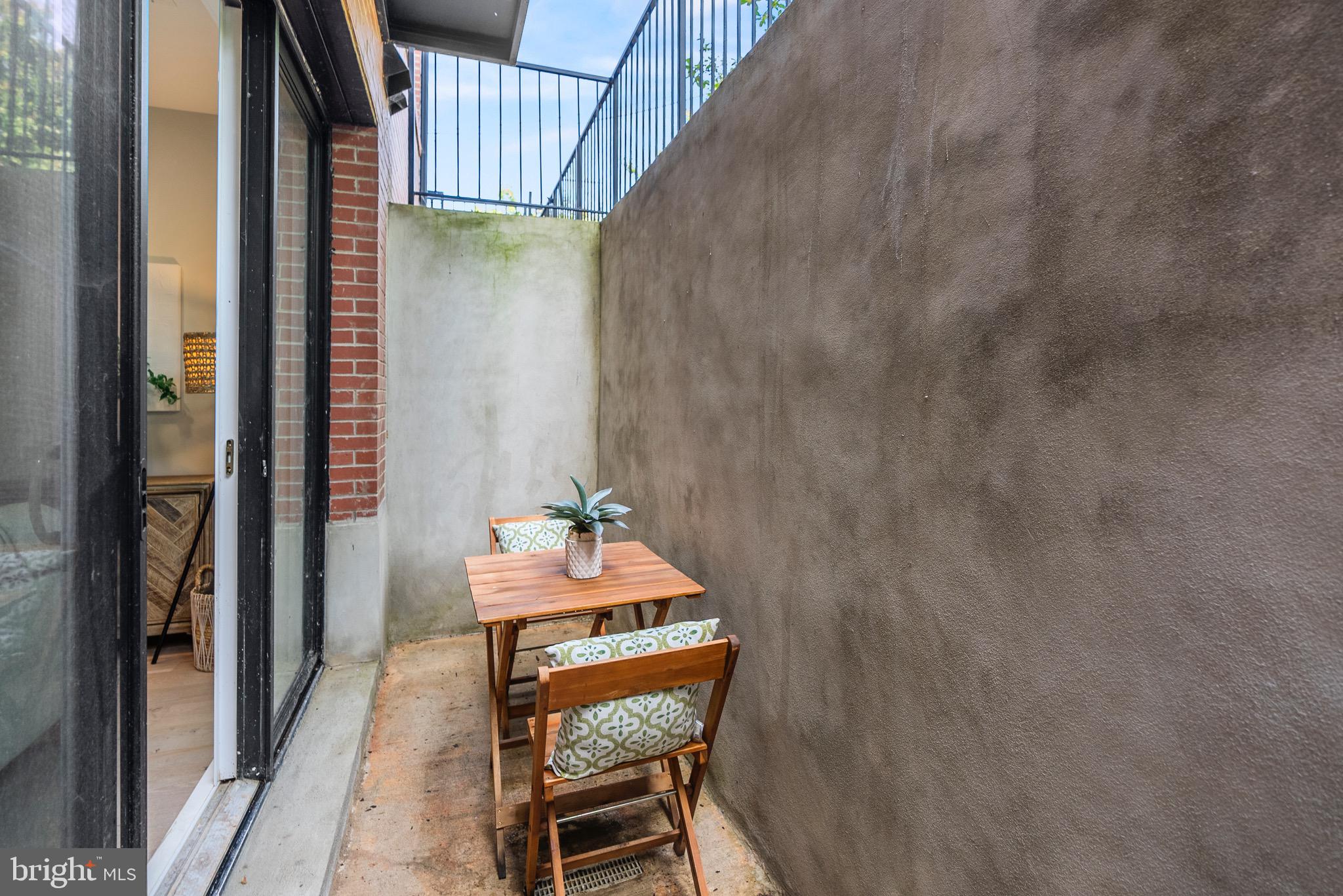 2019 M Street Northeast, Unit 1 Washington, DC 20002 - Photo 28 of 31 a balcony with chairs and table