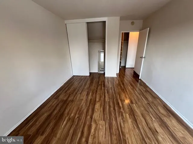 a view of wooden floor in an empty room