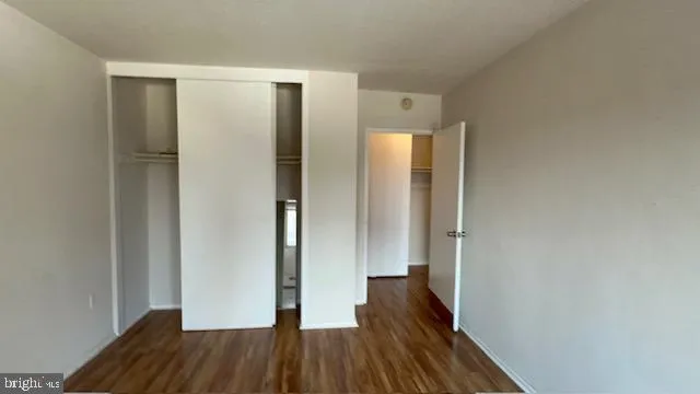 a view of hallway with wooden floor