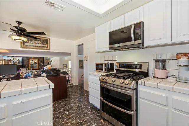 a kitchen with a stove and a microwave