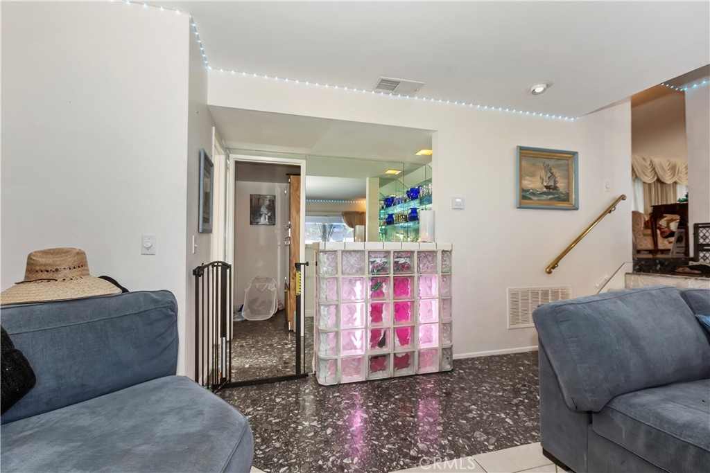 7055 Mango Street Rancho Cucamonga, CA 91701 - Photo 15 of 32 a living room with furniture and a wooden floor