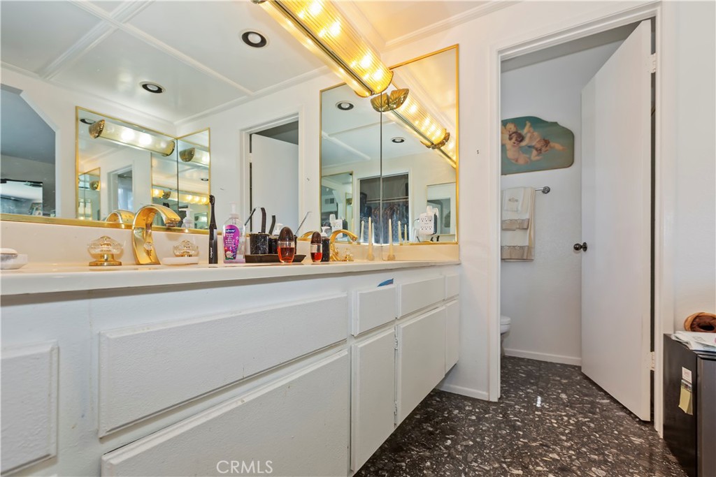 7055 Mango Street Rancho Cucamonga, CA 91701 - Photo 21 of 32 a bathroom with a double vanity sink and a mirror