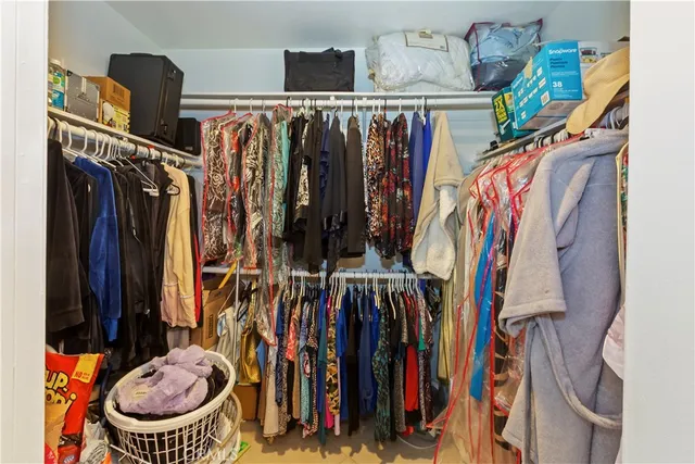 a bathroom with a sink mirror and toilet