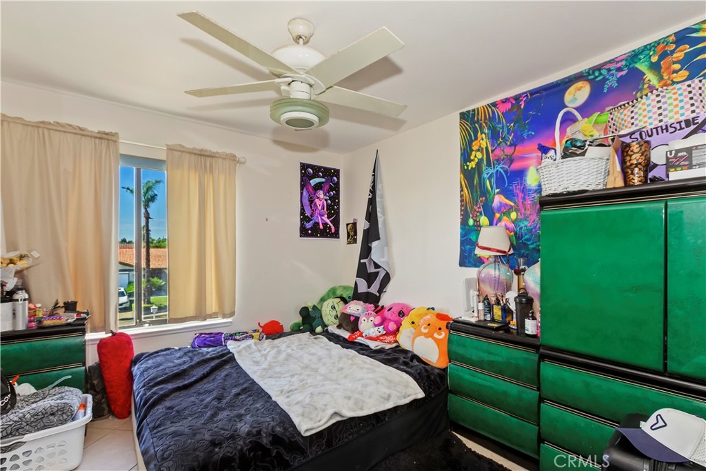 7055 Mango Street Rancho Cucamonga, CA 91701 - Photo 26 of 32 a bed room with a bed window and a baby crib