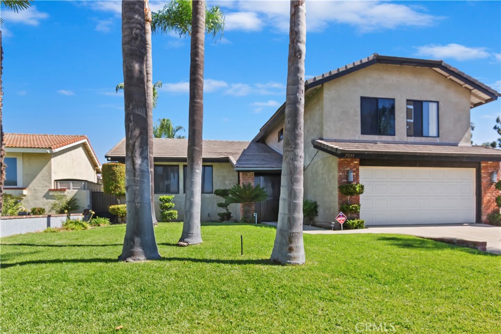 7055 Mango Street Rancho Cucamonga, CA 91701 - Photo 3 of 32 a front view of a house with a yard
