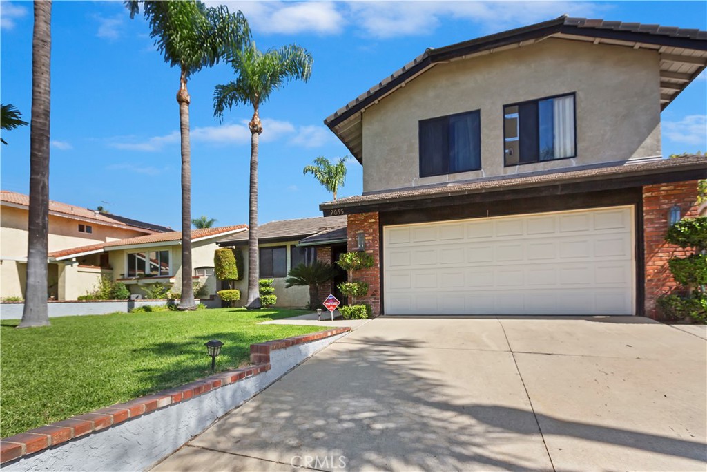 7055 Mango Street Rancho Cucamonga, CA 91701 - Photo 5 of 32 a front view of house along with yard