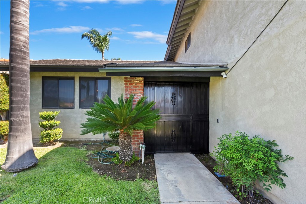 7055 Mango Street Rancho Cucamonga, CA 91701 - Photo 6 of 32 a view of a entryway door of the house
