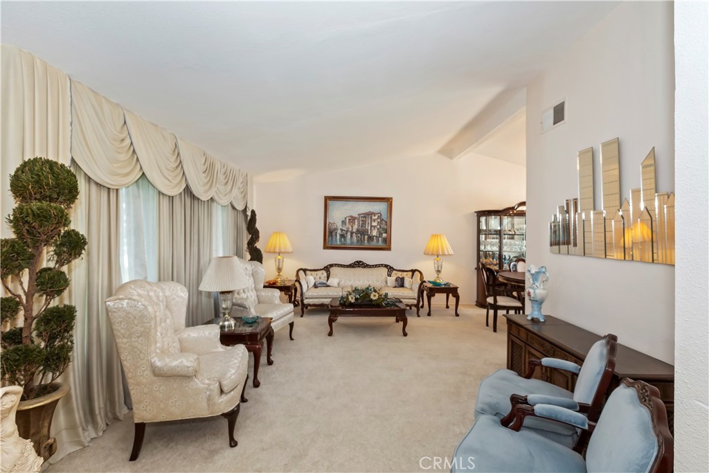 7055 Mango Street Rancho Cucamonga, CA 91701 - Photo 8 of 32 a living room with furniture and a chandelier