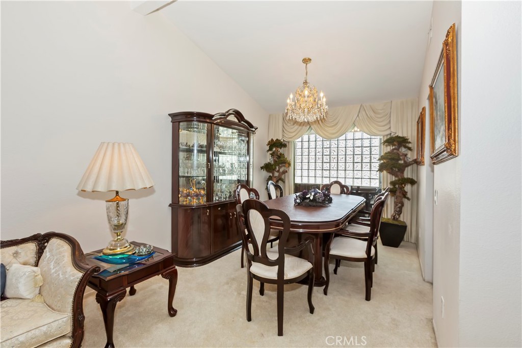 7055 Mango Street Rancho Cucamonga, CA 91701 - Photo 9 of 32 a living room with furniture and a chandelier