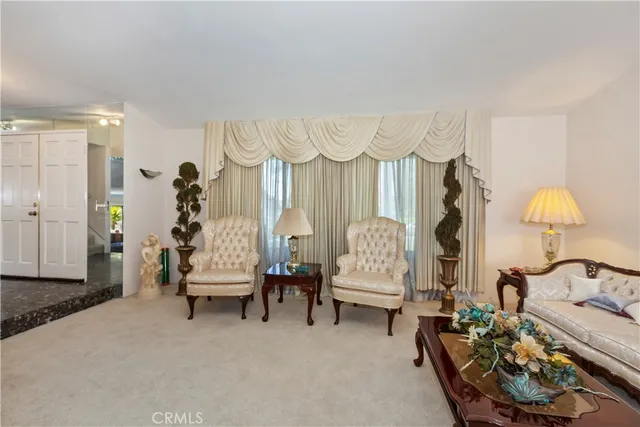 a living room with furniture and a table