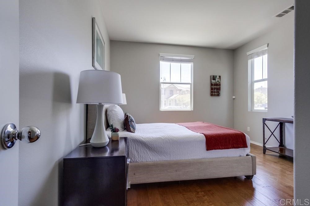3400 Filoli Circle Carlsbad, CA 92009 - Photo 16 of 42 a bedroom with a bed window and a lamp