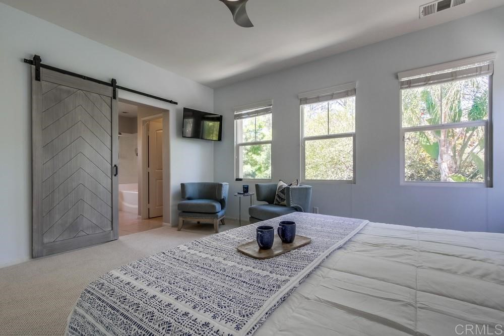 3400 Filoli Circle Carlsbad, CA 92009 - Photo 23 of 42 a living room with furniture and window